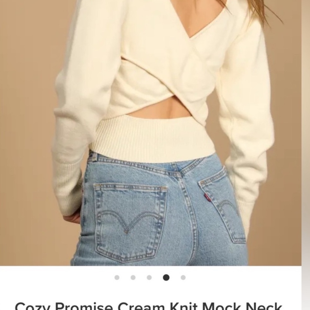 Cream cross back sweater.